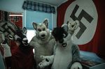  black_fur black_hair black_nose brown_eyes canine caprine clothing flag fur fursuit goat green_eyes hair hooves horn invalid_tag mammal nazi nude open_mouth pawpads raven-wolf real source_request swastika unknown_artist white_fur wolf 