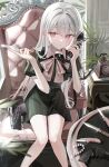 1girl antique_phone bag black_dress blurry blurry_foreground bow brown_bow chair closed_mouth collared_dress commentary_request depth_of_field dress grey_hair gun hair_between_eyes handbag hands_up highres holding holding_knife holding_phone iren_lovel knife long_hair on_chair original phone puffy_short_sleeves puffy_sleeves red_eyes short_sleeves sitting solo striped_clothes striped_dress vertical-striped_clothes vertical-striped_dress very_long_hair weapon weapon_request 