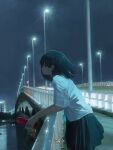  1girl against_railing black_hair bridge cellphone charm_(object) city closed_mouth expressionless flip_phone from_side highres holding holding_phone lamppost medium_hair night original outdoors phone pleated_skirt profile railing scenery shirt short_sleeves skirt solo utwob0 water white_shirt 