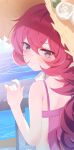  1girl absurdres against_railing armpit_crease blue_archive blue_eyes blush commentary_request flower fluffy_hair from_behind hat hat_flower highres iroha_(blue_archive) iroha_(swimsuit)_(blue_archive) long_hair looking_at_viewer ocean official_alternate_costume railing red_hair solo sun_hat swimsuit tsui_(dfjw5724) water 