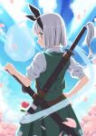  1girl belt black_hairband blue_eyes blunt_ends brown_belt closed_mouth commentary_request cowboy_shot flower from_behind green_skirt green_vest grey_hair hairband hand_on_own_hip highres inuno_rakugaki konpaku_youmu konpaku_youmu_(ghost) looking_at_viewer looking_back petals pink_flower pink_petals sheath sheathed shirt short_hair short_sleeves skirt smile solo sword touhou vest weapon weapon_on_back white_shirt 