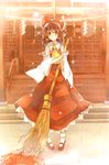  atoki bamboo_broom bow broom brown_eyes brown_hair hair_bow hair_tubes hakurei_reimu highres light_particles mary_janes pigeon-toed rope shide shimenawa shoes shrine solo touhou 