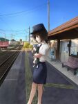  1girl amagami animal artist_name bench blue_hat blue_necktie blue_skirt blunt_bangs brown_eyes brown_hair building bulletin_board bush cat closed_mouth commentary day from_side hat highres holding holding_animal holding_cat house looking_ahead looking_down momonjya necktie outdoors peaked_cap power_lines railroad_tracks shirt short_hair short_sleeves sign signature skirt smile standing tachibana_miya tactile_paving town train train_attendant train_conductor train_station train_station_platform travel_attendant tuxedo_cat utility_pole white_shirt 