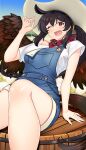  1girl bandana bandana_around_neck blue_overalls breasts brown_wings commentary_request cowboy_hat day feathered_wings hat hataraki_kuma highres kurokoma_saki large_breasts looking_at_viewer one_eye_closed open_mouth overalls paid_reward_available ponytail red_bandana red_eyes shirt sitting smile solo thighs touhou white_shirt wings 