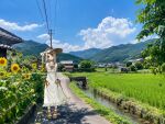  1girl ai-assisted ai-generated_background arms_behind_back blue_sky cloud commentary dress expressionless flat_chest flower full_body gakuen_idolmaster grass grey_hair hat idolmaster long_hair looking_at_viewer mountainous_horizon nature orange_eyes outdoors scenery shinosawa_hiro sky solo sun_hat sundress sunflower sunlight tyomemirin white_dress 