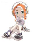  1girl bare_legs black_shorts blush_stickers dolphin_shorts fingerless_gloves gloves green_eyes headphones highres looking_at_viewer octoling octoling_girl octoling_player_character orange_hair print_shirt pukur sandals shirt shoes short_sleeves shorts simple_background sitting smile solo sparkling_eyes splatoon_(series) t-shirt tentacle_hair toes twitter_username white_background white_shirt 