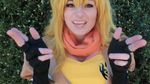  animated animated_gif blonde_hair breasts cosplay female kayla_erin long_hair lowres photo rwby smile solo yang_xiao_long 