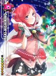  belt capelet card_(medium) character_name christmas_lights christmas_ornaments closed_mouth fur_trim haru_(haru2079) highres hood looking_at_viewer love_live! love_live!_school_idol_project miniskirt nishikino_maki parody pleated_skirt pom_pom_(clothes) red_eyes red_hair short_hair skirt smile solo 