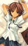  arm_behind_head arms_up bed brown_hair cellphone copyright_request looking_at_viewer lying nagi_ryou phone school_uniform short_hair short_sleeves smile solo 