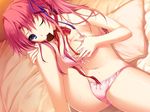 1girl bed blue_eyes blush bra breast_grab breasts chocolate game_cg grabbing highres iizuki_tasuku large_breasts leg_up legs long_hair looking_at_viewer lovely_x_cation mouth_hold panties pillow pink_hair sitting solo sweat thighs underwear wink 