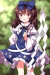  1girl :d black_ribbon blue_bow blue_dress blurry blurry_background blush bow brown_hair commentary_request cosplay dress frilled_shirt_collar frills gohei hair_between_eyes hair_bow hakurei_reimu highres holding holding_stick long_hair open_mouth outdoors petticoat pink_eyes ribbon ruu_(tksymkw) smile solo star_sapphire star_sapphire_(cosplay) stick touhou 