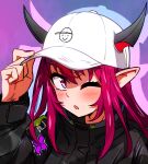  1girl baseball_cap black_jacket blush ddolbang guyrys hat hololive hololive_english horns irys_(hololive) irys_(irys_2.0)_(hololive) jacket long_hair looking_at_viewer multiple_horns one_eye_closed pink_eyes pink_nails pointy_ears red_hair simple_background solo virtual_youtuber 