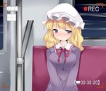  blonde_hair breasts commentary dress hammer_(sunset_beach) hat large_breasts long_hair looking_at_viewer maribel_hearn mob_cap neckerchief purple_eyes recording sitting touhou train_interior viewfinder 