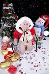  1girl asian breasts cage candy chouzuki_maryou christmas christmas_tree cosplay gift headphones large_breasts nitroplus photo pink_hair plump present solo stocking super_sonico super_sonico_(cosplay) thighhighs 