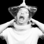  1boy bag bag_over_head male_focus monochrome non-web_source off-topic photo_(medium) plastic_bag solo 
