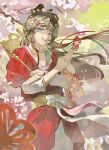  1girl absurdres between_fingers black_hair blue_eyes chinese_clothes chinese_commentary chinese_paper-cut commentary_request facial_mark floating_hair flower forehead_mark green_background grin hair_branch hair_bun hands_up hanfu hat_on_back highres holding holding_paper layered_sleeves long_hair long_sleeves paper paper_heron papercutting pink_flower red_hanfu reverse:1999 short_over_long_sleeves short_sleeves smile solo upper_body weimao wu_fuzuoyong 