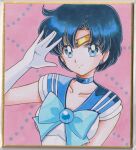  1girl \||/ ahoge bishoujo_senshi_sailor_moon blue_bow blue_choker blue_eyes blue_gem blue_hair blue_sailor_collar bow breasts brooch chikoto_(kztc4472) choker collarbone commentary earrings elbow_gloves eyelashes gem gloves hand_up highres jewelry leotard looking_at_viewer magical_girl medium_breasts mizuno_ami parted_bangs photo_(medium) picture_frame pink_background polka_dot sailor_collar sailor_mercury sailor_senshi_uniform short_hair short_sleeves simple_background smile solo straight-on tiara traditional_media upper_body white_gloves white_leotard 