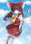  1girl ascot bow brown_eyes brown_hair closed_mouth commentary detached_sleeves frilled_bow frilled_hair_tubes frilled_skirt frills gohei hair_bow hair_tubes hakurei_reimu highres holding holding_gohei long_hair looking_at_viewer red_bow red_skirt reflection reflective_liquid ribbon-trimmed_sleeves ribbon_trim ripples skirt skirt_set smile socks solo touhou wanko_sora water white_socks yellow_ascot 