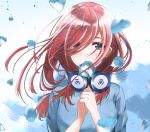  1girl bangs blue_dress blue_eyes blush breasts commentary_request dress flower go-toubun_no_hanayome hair_between_eyes hair_over_eyes hands_clasped headphones headphones_around_neck highres holding holding_flower long_hair looking_at_viewer medium_breasts nakano_miku own_hands_together petals red_hair solo taku3949 upper_body 
