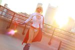  1girl absurdres asian boots breasts cleavage cleavage_cutout cosplay dc_comics high_heels highres large_breasts power_girl short_hair yaya_han 