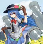 arm_up blue_hair bow cloud day dress field flower flower_field food frown fruit gloves hat hinanawi_tenshi keystone long_hair looking_at_viewer mountain nano_(ex925868312) peach red_eyes short_sleeves sky solo sword_of_hisou touhou weapon 
