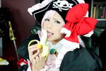  1girl banana breasts captain_liliana captain_liliana_(cosplay) chouzuki_maryou cosplay food fruit hat large_breasts lost_worlds photo pink_hair pirate pirate_hat plump purple_eyes queen&#039;s_blade queen's_blade queen's_blade_rebellion sexually_suggestive 