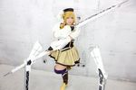  1girl asian blonde_hair breasts brown_eyes chouzuki_maryou cosplay drill_hair fingerless_gloves gloves gun hat large_breasts magical_musket mahou_shoujo_madoka_magica musket photo plump solo tomoe_mami tomoe_mami_(cosplay) twin_drills weapon 