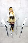  1girl asian blonde_hair breasts brown_eyes chouzuki_maryou cosplay drill_hair fingerless_gloves gloves gun hat large_breasts magical_musket mahou_shoujo_madoka_magica musket photo plump solo tomoe_mami tomoe_mami_(cosplay) twin_drills weapon 