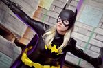  1girl aigue_marine bat_(symbol) batgirl batman_(series) blonde_hair cape cosplay dc_comics gauntlets gloves mask photo solo stephanie_brown 