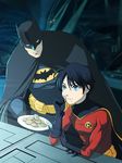  2boys batcave batman batman_(series) black_hair blue_eyes bruce_wayne cape computer cookie dc_comics desk eating father father_and_son food gauntlets gloves male male_focus mask multiple_boys robin_(dc) sitting tim_drake 