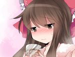  barley_tea blush bow brown_eyes brown_hair commentary cup hair_bow hakurei_reimu hammer_(sunset_beach) ice long_hair pink_background ribbon sidelocks solo touhou towel translated upper_body wavy_mouth 