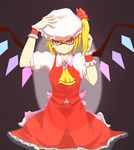  ascot asymmetrical_hair black_background blonde_hair bow brooch colored_eyelashes crystal dress fang fang_out flandre_scarlet hair_bow hand_on_headwear hat highres jewelry looking_at_viewer mob_cap red_dress red_skirt shaded_face short_hair side_ponytail skirt skirt_set smile solo touhou tsutsunuke wings wrist_cuffs 