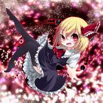  black_legwear blonde_hair bow darkness hair_bow hair_ribbon kayama_benio light_particles looking_at_viewer open_mouth outstretched_arm petals red_eyes ribbon rumia short_hair skirt smile solo thighhighs touhou 
