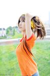  cosplay hairband highres orange_shirt photo ponytail shirt solo suzumiya_haruhi suzumiya_haruhi_(young) suzumiya_haruhi_no_yuuutsu 