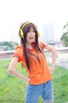  cosplay hairband highres orange_shirt photo shirt solo suzumiya_haruhi suzumiya_haruhi_(young) suzumiya_haruhi_no_yuuutsu 