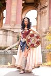  1girl amazon armor black_hair cape cosplay dc_comics greaves meagan_marie outdoors photo pteruges sandals shield standing sword vambraces water weapon wonder_woman wonder_woman_(cosplay) wonder_woman_(series) 