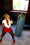  1girl asian blonde_hair blue_eyes boxing_ring breasts chouzuki_maryou cosplay fingerless_gloves gloves large_breasts miss_spencer miss_spencer_(cosplay) photo punching_bag rumble_roses rumble_roses_xx solo 