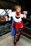  1girl asian blonde_hair blue_eyes boxing_ring breasts chouzuki_maryou cosplay fingerless_gloves gloves large_breasts miss_spencer miss_spencer_(cosplay) photo rumble_roses rumble_roses_xx solo 