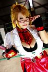  1girl asian blonde_hair blue_eyes boxing_ring breasts chouzuki_maryou cosplay fingerless_gloves glasses gloves large_breasts miss_spencer miss_spencer_(cosplay) photo rumble_roses rumble_roses_xx solo 