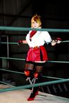  1girl asian blonde_hair blue_eyes boxing_ring breasts chouzuki_maryou cosplay fingerless_gloves gloves large_breasts miss_spencer miss_spencer_(cosplay) photo rumble_roses rumble_roses_xx solo 