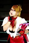  1girl asian blonde_hair blue_eyes boxing_ring breasts chouzuki_maryou cosplay fingerless_gloves glasses gloves large_breasts miss_spencer miss_spencer_(cosplay) photo rumble_roses rumble_roses_xx solo 