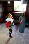  1girl asian blonde_hair blue_eyes boxing_ring breasts chouzuki_maryou cosplay fingerless_gloves gloves large_breasts miss_spencer miss_spencer_(cosplay) photo punching_bag rumble_roses rumble_roses_xx solo 