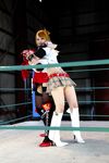  arena blonde_hair boxing_ring breasts candy_cane_(rumble_roses) candy_cane_(rumble_roses)_(cosplay) chouzuki_maryou cleavage cosplay fingerless_gloves gloves large_breasts miss_spencer miss_spencer_(cosplay) multiple_girls photo red_hair rumble_roses rumble_roses_xx suzuka_itsuki 