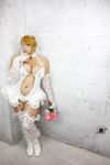  1girl blonde_hair blue_eyes bouquet breasts bridal_veil chouzuki_maryou cleavage cosplay dress eyepatch flower gloves large_breasts mistress_spencer mistress_spencer_(cosplay) photo rumble_roses rumble_roses_xx solo tiara veil wedding_dress 