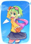  :d brown_gloves fang gloves goggles goggles_on_head green_eyes green_hair gumi hand_on_own_head headphones highres looking_at_viewer open_mouth paper_airplane pleated_skirt rowtan scarf school_uniform serafuku short_hair short_hair_with_long_locks sidelocks skirt smile solo vocaloid 
