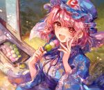  1girl ayatsuki_sugure blue_hat blue_kimono dango eating food frilled_kimono frills hat holding holding_skewer japanese_clothes kimono long_sleeves mob_cap neck_ribbon pink_eyes pink_hair ribbon saigyouji_yuyuko sanshoku_dango skewer solo touhou triangular_headpiece wagashi wide_sleeves 