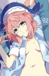  1girl :&lt; arm_behind_head arm_up bed_sheet blue_shirt blush breasts closed_mouth commentary_request eyelashes green_eyes head_tilt highres jack_(wkm74959) lying navel okunoda_miyoi on_back open_clothes open_shirt pillow pink_hair shirt short_hair short_sleeves small_breasts solo sweat touhou v-shaped_eyebrows whale_hat 