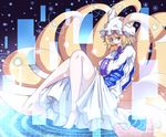  animal_ears atami blonde_hair food fox_ears fox_tail grin hat legs long_sleeves looking_at_viewer multiple_tails short_hair smile solo tail tofu touhou yakumo_ran yellow_eyes 