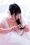  1girl asian black_hair breasts brush cleavage corsage dress eyes_closed fat hair hair_ornament hoshima_mika huge_breasts jewelry long_breasts long_hair necklace photo plump sitting solo star wedding_dress 