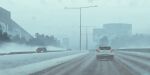  absurdres architecture building car cloud cloudy_sky day highres lamppost motor_vehicle no_humans outdoors road science_fiction simon_stalenhag sky snow swedish_machines tree 